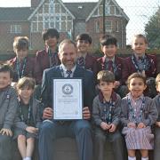 St Edward\'s Prep School has won the Guinness World Record for the biggest plastic bottle sentence. Pictured are pupils and Jonathan Parsons, the heateacher. Credit: St Edwards Prep & Nursery School