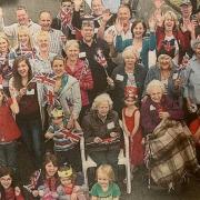Smiles all round as neighbours in Hilltop Road wave flags and wish The Queen a happy Diamond Jubilee (2012)