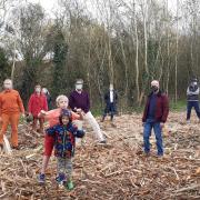 Neighbours and Liberal Democrats protesting after the land, which they refer to as \'Swallows Meadow\' was \'deforested\' by contractors in November 2020. Credit: Wokingham Liberal Democrats