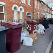 Overstuffed bins and waste bags left on the street in East Reading. Credit: James Aldridge, Local Democracy Reporting Service