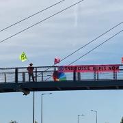 XR members banner protesting on the M4 motorway