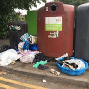 Flytipping at the bottle banks at St Pau\'s Court in West Reading. Credit: Nick Fudge