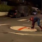 Spider-Man, Spider-Man,
Does whatever a spider can,
Gets a can, which is red, 
Paints the road, then of he fled, 
Look out, here comes the Spider-Man