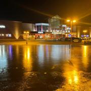 Cinema carpark transformed into ice rink after flooding from River Loddon