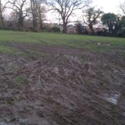 Cintra Park left in a muddy mess after it was used for car parking during a junior football match. Credit: UGC