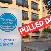 Thames Water has pulled down a sign renaming its £43million headquarters 'Dirtywater Caught'