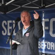 Councillor John Ennis, a lifelong Reading FC fan, speaks at the start of the Sell Before We Dai rally at Blue Collar Street Food in Reading. Credit: Sell Before We Dai