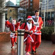 Watch as hundreds of Santas race each other