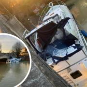 Large boat gets stuck under Caversham Bridge then STOLEN from amid flooding crisis
