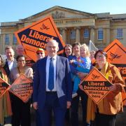 The Reading Liberal Democrats with their national party leader Sir Ed Davey outside the Royal Berkshire Hospital.