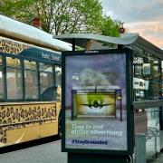 A  hijacked bus advert in Reading calling for an end to advertising that is promoting our self destruction, with the hashtag #StayGrounded.