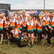 The cast of The Traitors celebrate finishing the Tough Mudder