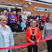 Cutting the tape with Annemarie Byrnes and Zoe Brown 181084 Mayor Debs Edwards opens the Southcote Hub - PIctures: Mike Swift.