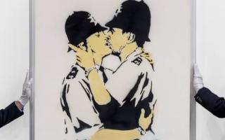Kissing Coppers by Banksy (Joshua White/Sotheby’s/PA)