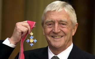 Michael Parkinson who was awarded a CBE at Buckingham Palace in London, as he has died at the age of 88