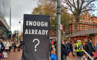 Enough Already? Activists cover digital screens in Reading.