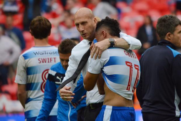 Jaap Stam consoles Jordan Obita after the play-off final defeat to Huddersfield.